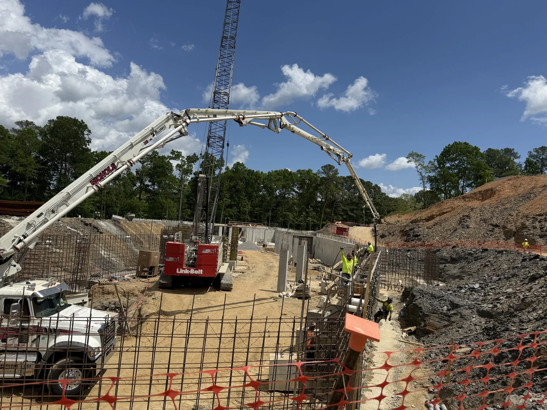 Concrete pump operating at a large foundation project