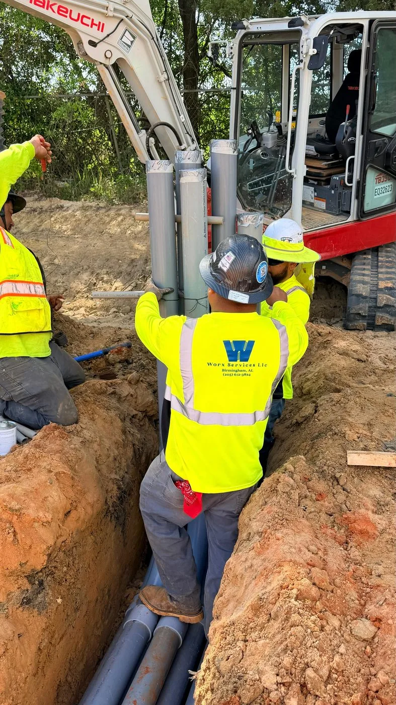 WORX Services crew installing underground conduit
