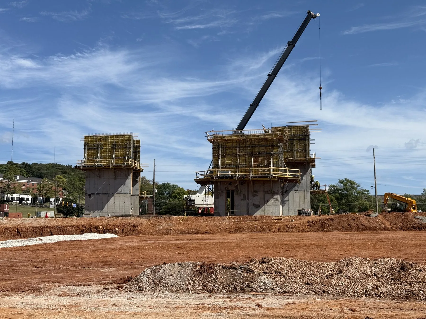 Concrete structures and crane at an active jobsite